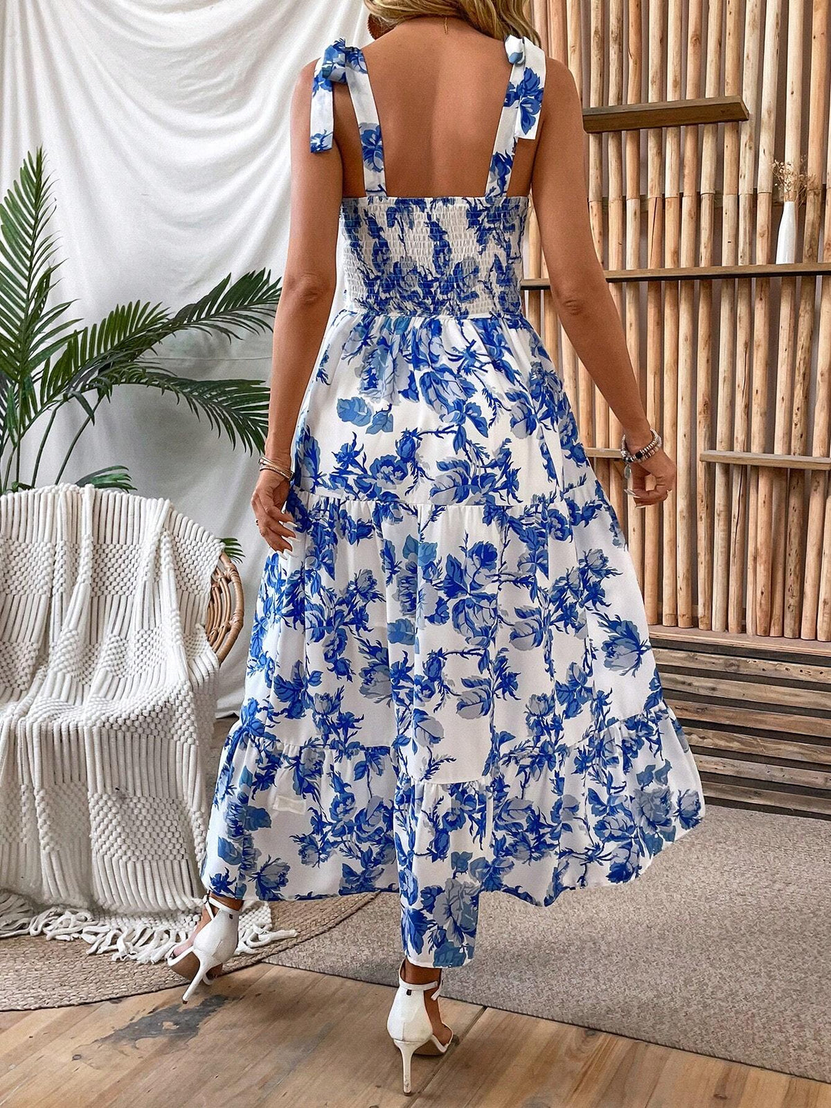 Blue and white floral tiered maxi dress with smocked open back, back view