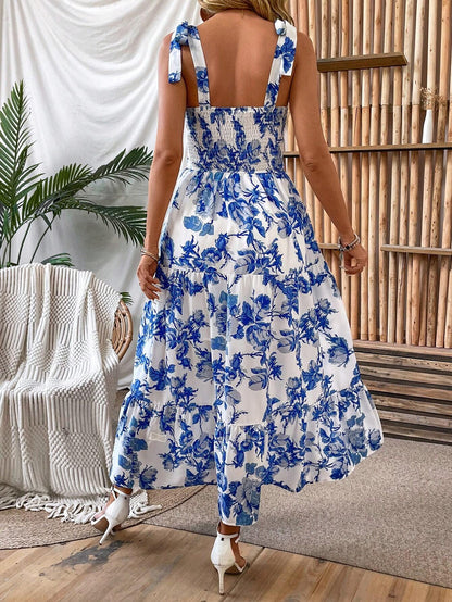 Blue and white floral tiered maxi dress with smocked open back, back view