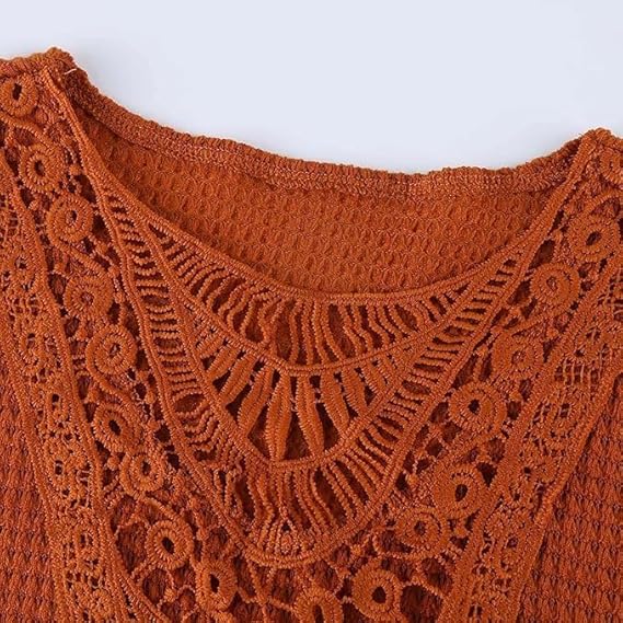 Close-up of the crochet lace neckline of the rust orange tunic top