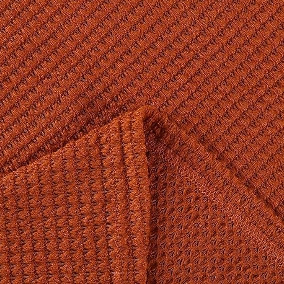 Close-up of the rust orange waffle-knit fabric