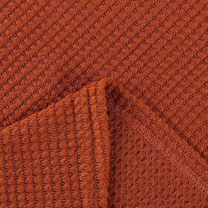 Close-up of the rust orange waffle-knit fabric