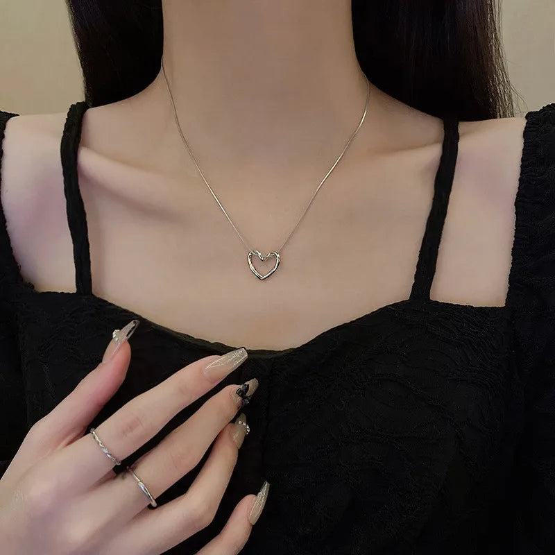 Twisted Hollow Heart Pendant Necklace (photo 2)