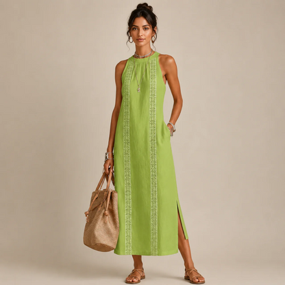 Woman wearing a lime green sleeveless halter-neck dress with a lace-trim center panel and a side slit, holding a tan tote bag