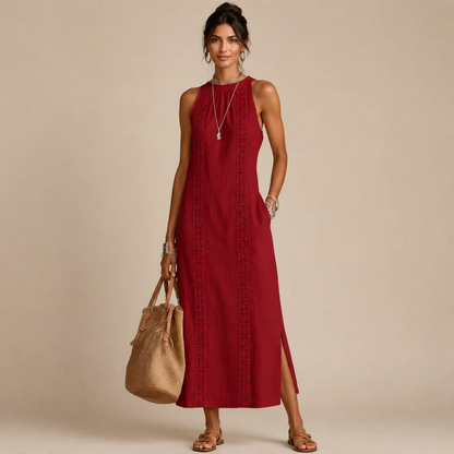 Woman wearing a red sleeveless halter-neck dress with a lace-trim center panel and a side slit, holding a tan tote bag