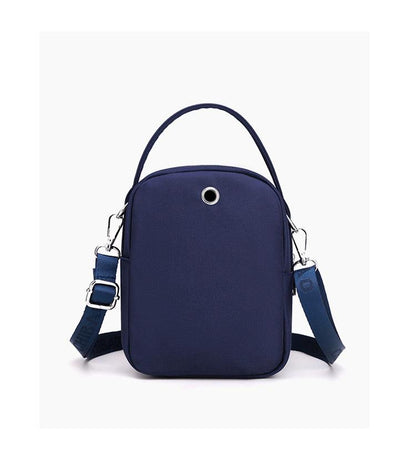 Back of the navy shoulder bag with top handle and strap