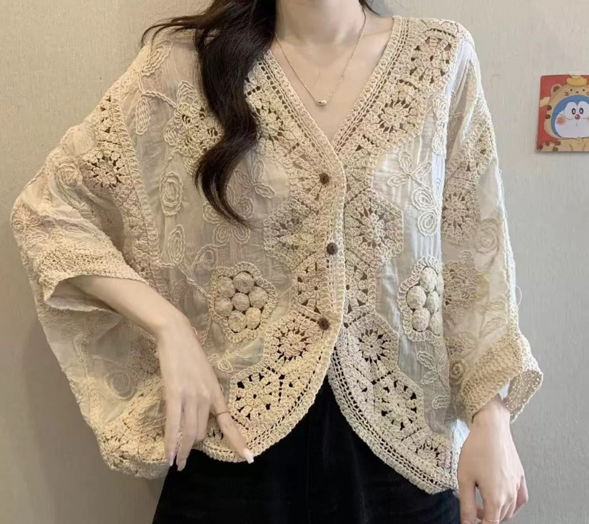 Beige crochet lace button-front cardigan with floral motifs and a V-neckline, front view