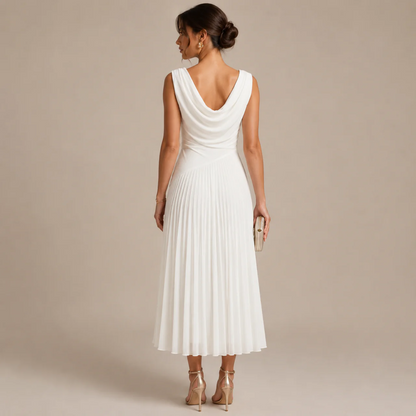 Back view of the white chiffon midi dress with a draped cowl back