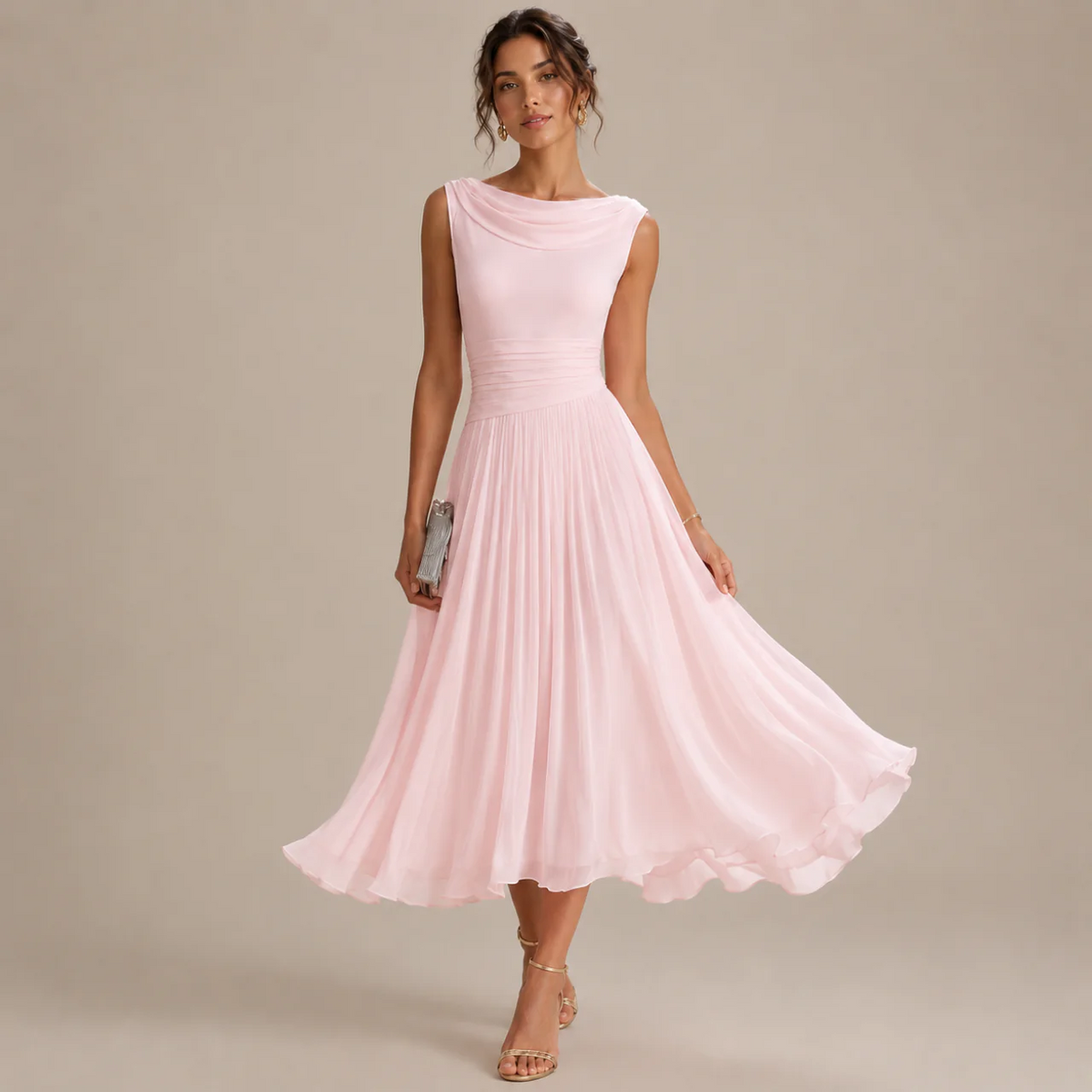 Woman wearing a light pink sleeveless chiffon midi dress with a flared pleated skirt, front view
