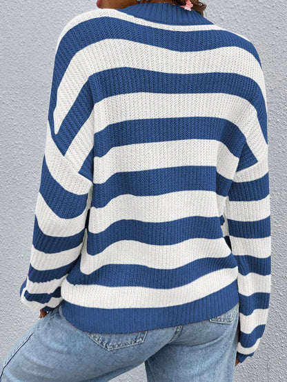Blue and white striped drop-shoulder sweater with jeans, front view