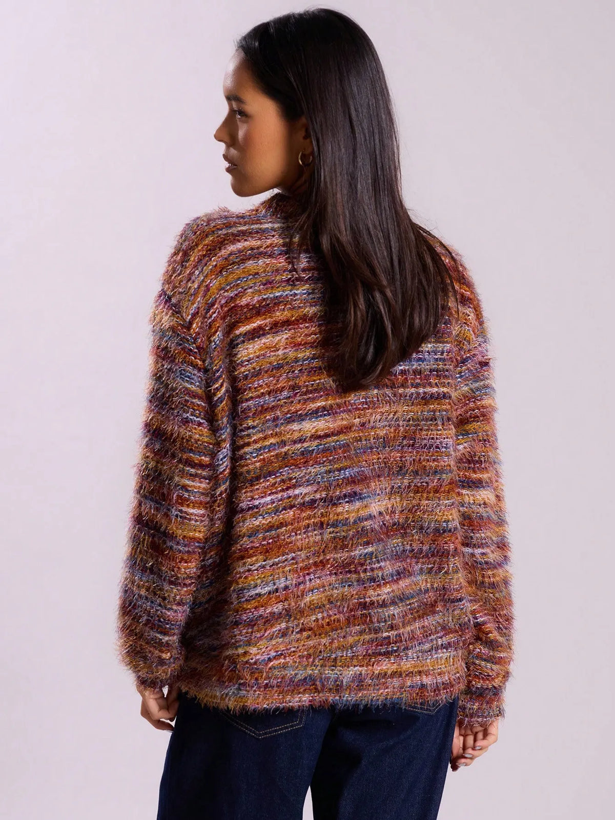 Back three-quarter view of the multicolor rust striped fuzzy knit cardigan