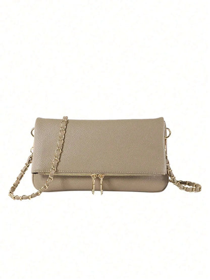 Taupe fold-over bag with a gold chain strap and zipper pull on a white background