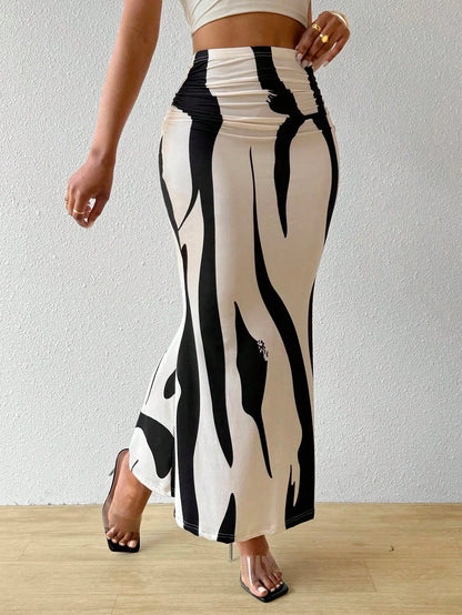 Black and white swirl print maxi skirt in a walking pose, three-quarter view