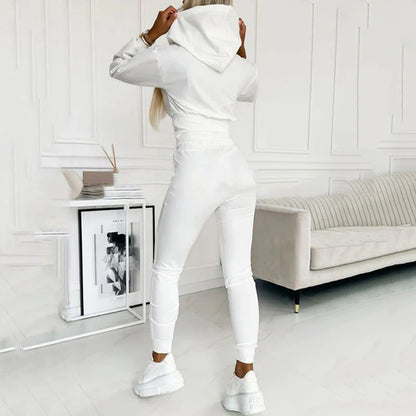 Back view of the white hooded top and matching white joggers with white sneakers