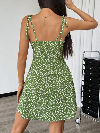 Back view of the green ditsy floral mini dress with tie shoulder straps