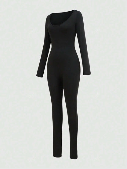 Black long-sleeve fitted jumpsuit with a scoop neckline, angled front view