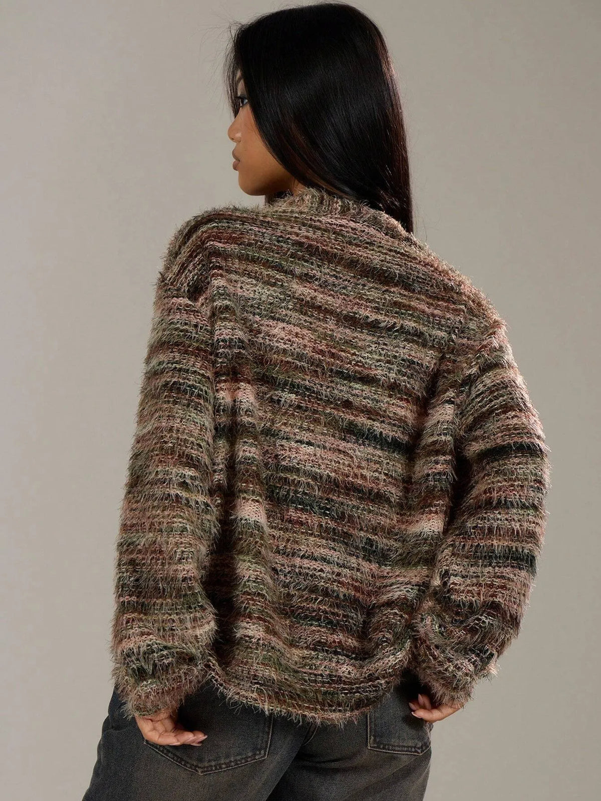 Back view of the brown and grey striped oversized knit cardigan